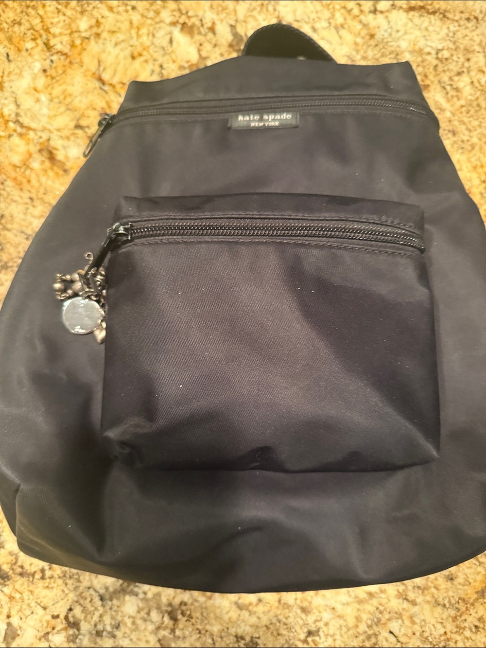 kate spade black nylon sling backpack with charm